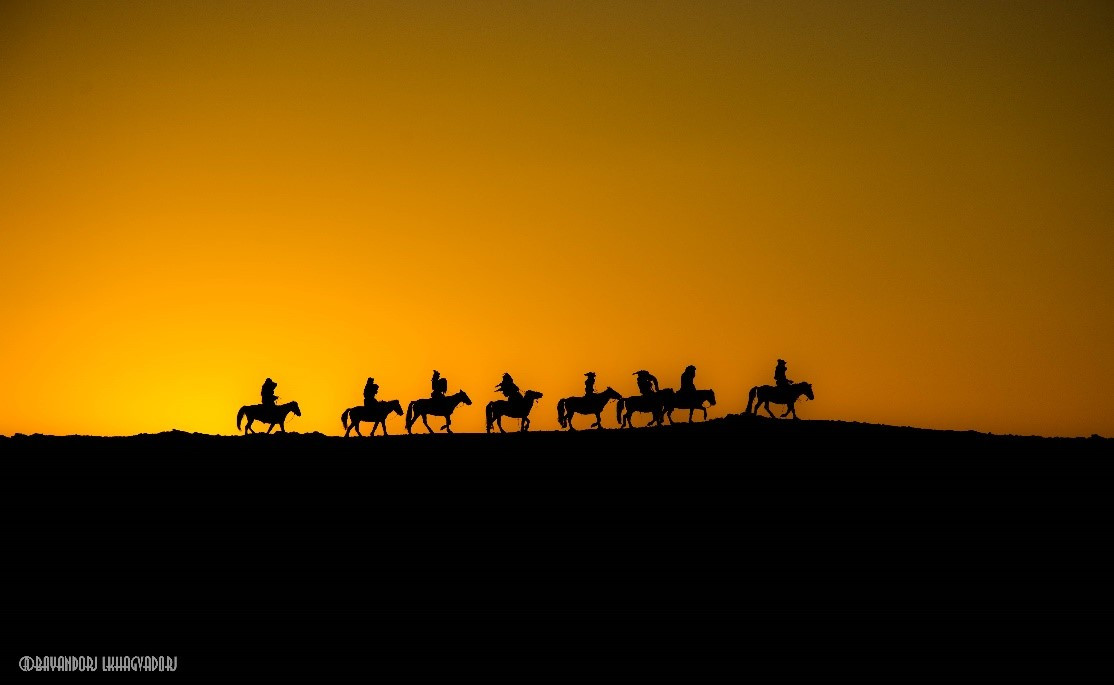 Eagle hunters at sunset