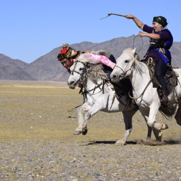 Traditional kazakh game on horse back, Kiz kuar- means woman chases man